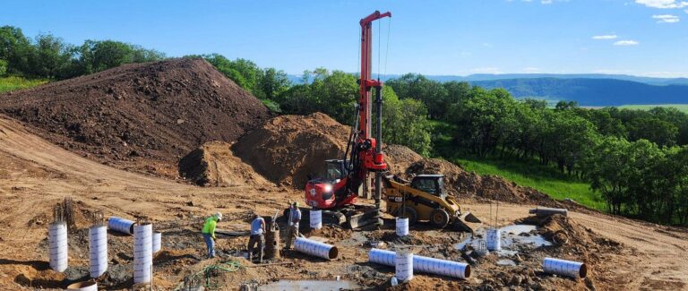 Construction of a new home nestled in the serene woods, blending harmoniously with nature's beauty.