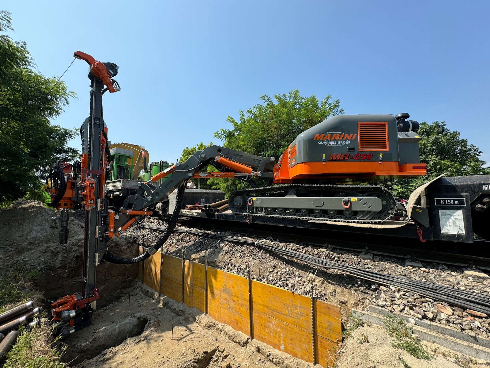 This image shows a Marini Quarries Group MR-C 90 (also labeled as MR-90), a radio-controlled hydraulic crawler drilling rig.