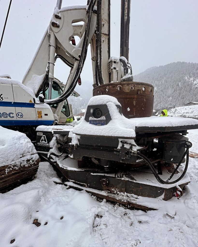 A large drilling machine on snow-covered ground