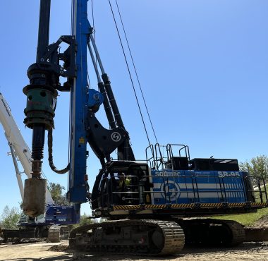 soilmec sr-95 tracked drill rig with extended mast on dirt construction site